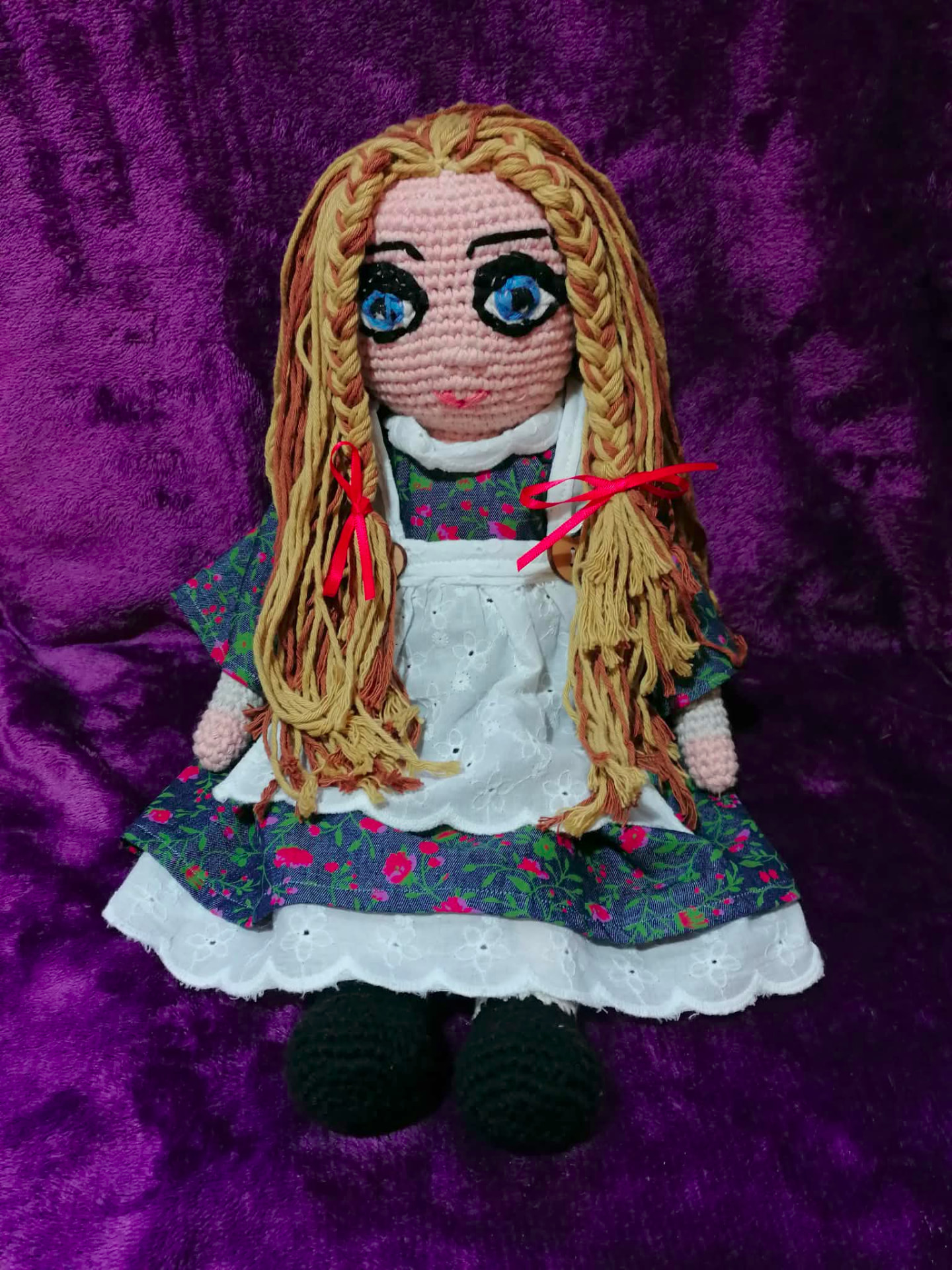 A handmade crocheted storybook character